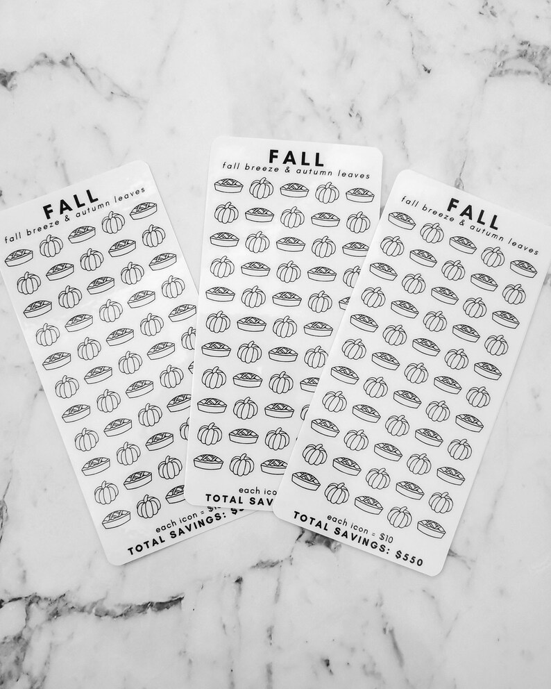 May include: Three sheets of stickers with a fall theme. Each sheet has a repeating pattern of pie and pumpkin icons. The text on the sheets reads "FALL fall breeze & autumn leaves" and "each icon $10 TOTAL SAVINGS: $550".