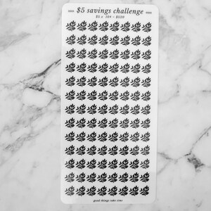 May include: A sheet of clear stickers with black floral designs. The sheet has the text "&pound;5 savings challenge" and "&pound;5 x 104 = &pound;520" printed on it. The bottom of the sheet says "good things take time".