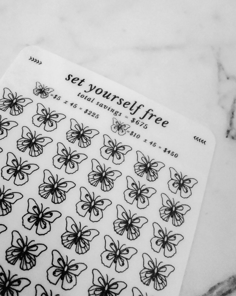May include: A white sheet with black butterfly stickers and the text "set yourself free" with a calculation of total savings. The text reads "total savings = $675", "$5 x 45 = $225", and "$10 x 45 = $450".