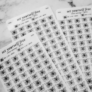 May include: Three sheets of clear sticker paper with black butterfly outlines. The text "set yourself free" is printed on each sheet, along with the total savings and a breakdown of the savings.