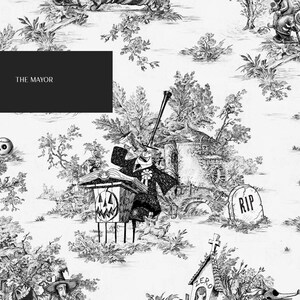 May include: Black and white illustration of a spooky Halloween scene with a mayor character standing on a platform with a pumpkin head. The scene is set in a graveyard with tombstones and trees. The text "THE MAYOR" is at the top of the image.