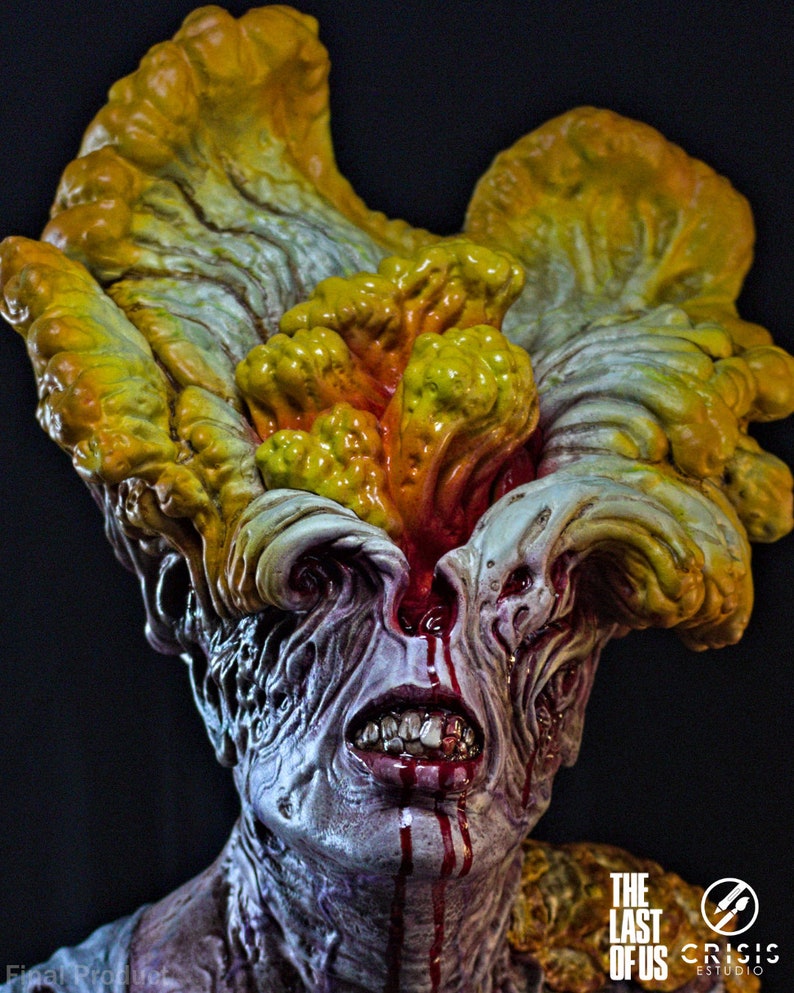 May include: A detailed sculpture of a Clicker from The Last of Us. The figure features a grotesque, mutated face with exposed teeth, blood, and fungal growth in shades of yellow, orange, and gray. The sculpture has the text "The Last of Us" and "Crisis Estudio".
