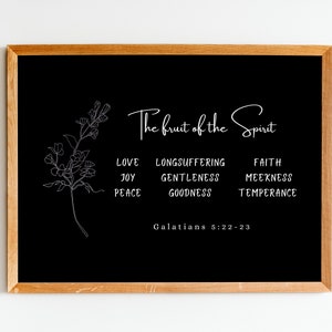May include: Black and white printable wall art featuring a floral design and the text "The fruit of the Spirit" with a list of nine virtues: love, joy, peace, longsuffering, gentleness, goodness, faith, meekness, and temperance. The text "Galatians 5:22-23" is at the bottom of the print.