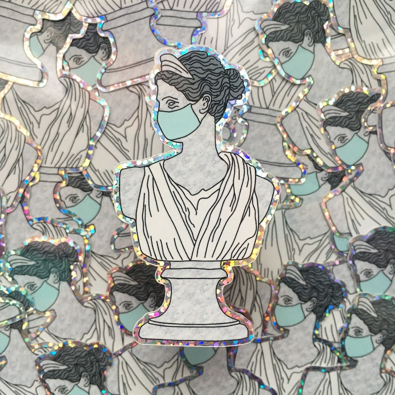May include: A sticker of a bust of a woman wearing a light blue face mask. The bust is white with a gray marble base. The sticker has a holographic finish.