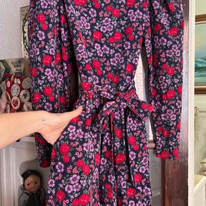 80’s vintage Laura Ashley navy blue corduroy puff sleeve dress with purple and pink floral pattern and pockets