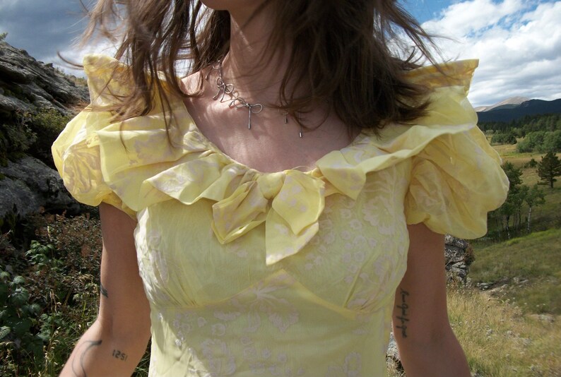 1940’s vintage pastel yellow puff sleeve dress with cream colored velour floral pattern image 2