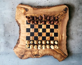 May include: A wooden chessboard with a natural wood finish. The board is set up with chess pieces, including pawns, rooks, knights, bishops, queens, and kings. The chessboard is made of olive wood and has a unique, rustic look.