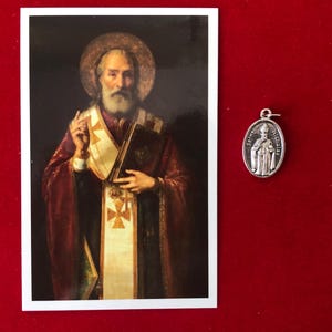 Zestaw medalików z relikwiami św. Mikołaja - relikwia trzeciej klasy, święta kartka i medalik (dot. relikwii św. Mikołaja z Bari/Miry)
