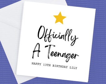 May include: A white card with black text that reads "Officially A Teenager" and "Happy 13th Birthday Lilly". A yellow star is in the top corner of the card.