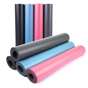 May include: A collection of rolled yoga mats in shades of black, blue, pink, and grey. The mats are displayed both upright and unrolled, highlighting their smooth, solid surfaces. Suitable for yoga and fitness activities.