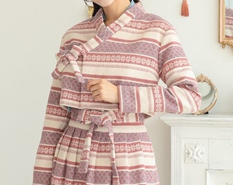 May include: A pink and white striped dress with a matching jacket. The jacket has a traditional Korean style collar and ties at the waist. The dress and jacket have a floral pattern.