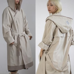 Modern Hanbok Raincoat, Light Beige Hooded Korean Durumagi Trench Coat, Waterproof Outerwear with Reflective Korean Symbol Design