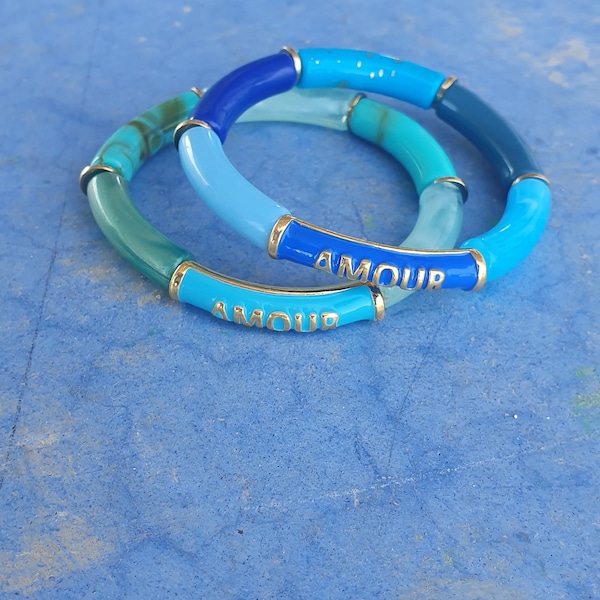 Elastic string bracelet with curved acrylic tubes blue Amour