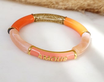 Bracelet jonc élastique en perles tubes incurvés acrylique orange saumon rose blanc talisman Amour