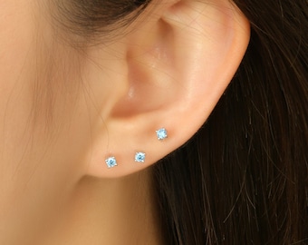 Tiny blue on sale stud earrings