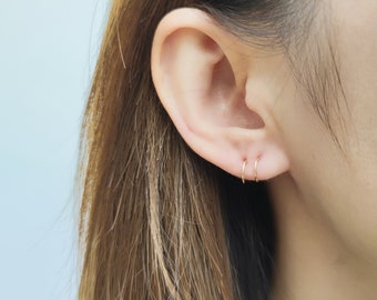 Mini hugging deals hoop earrings gold