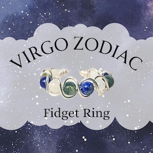 May include: A silver-toned fidget ring with blue, green, and white beads. The ring is labeled "Virgo Zodiac" and "Fidget Ring" in black text against a cloudy background with a starry sky.