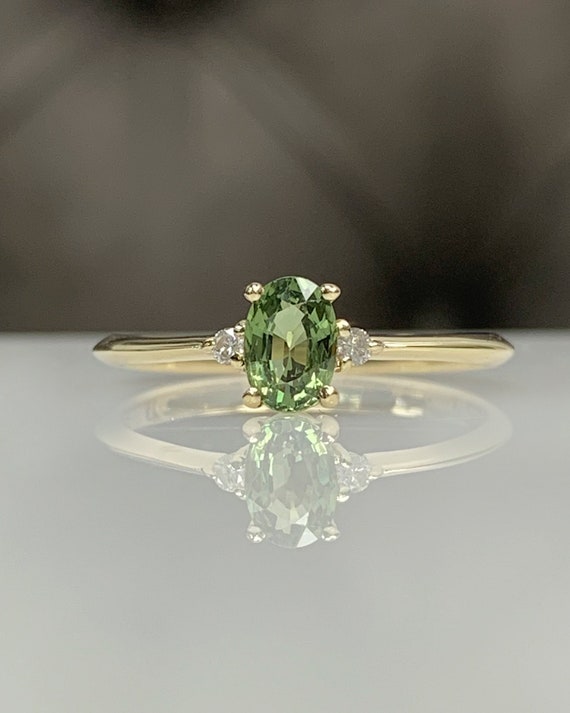 Reveniss: Intricate Oval Blue-Green Sapphire Ring | Ken & Dana Design