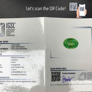 May include: IGSL Gemstone Report for a green sapphire gemstone. The report includes details such as the date, report number, species, variety, colour, transparency, shape and cut, weight, measurements, and comments. The report also includes a QR code for online verification.