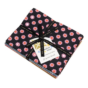 May include: A stack of fat quarter fabric squares tied with a black ribbon. The fabric is black with a repeating pattern of pink and white flowers. A tag reads "Shadow Star" and "fat quarter bundle".