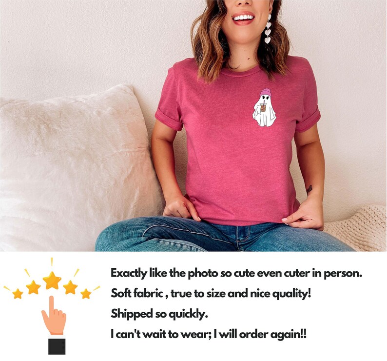 May include: A pink t-shirt with a white ghost wearing a pink hat and holding a cup. The ghost is printed on the front of the shirt.