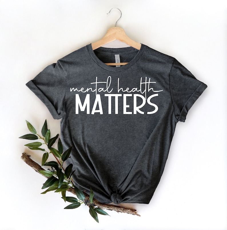May include: A dark gray t-shirt with the text "mental health MATTERS" in white lettering.