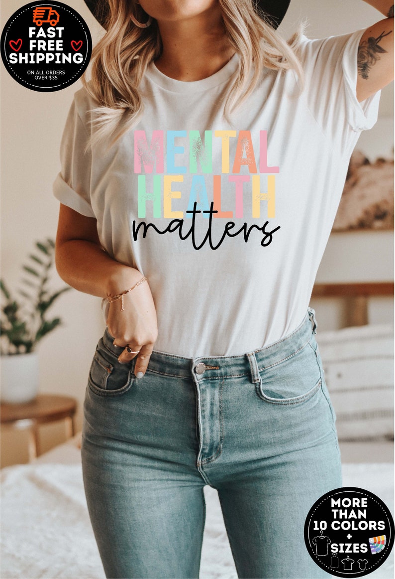May include: White t-shirt with the text "MENTAL HEALTH matters" in rainbow colours. The text is in a distressed font style.