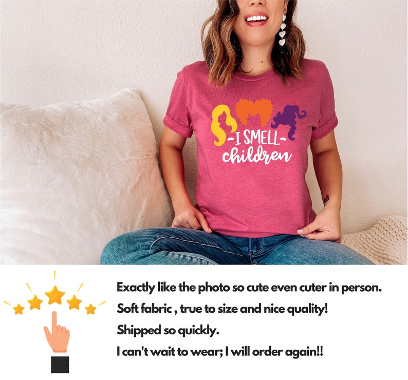 May include: A pink t-shirt with a graphic of three witches and the text "I Smell Children".