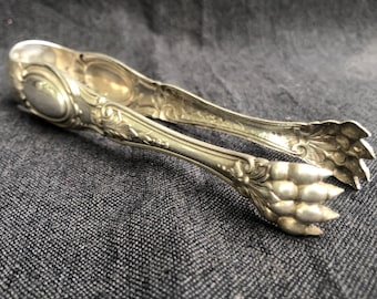 Antique Art Nouveau metalonide sugar tongs, manufactured by Cailar & Bayard, Paris, France, circa 1880s.