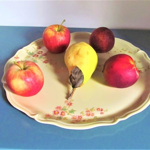 Vintage large plate of delicate creamy color with a floral decal technique manufactured by the Limoges manufactory, France
