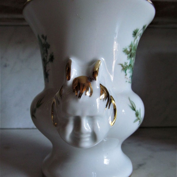 Small vintage porcelain vase from Limoges, France depicting a deity in the form of a male head with horns