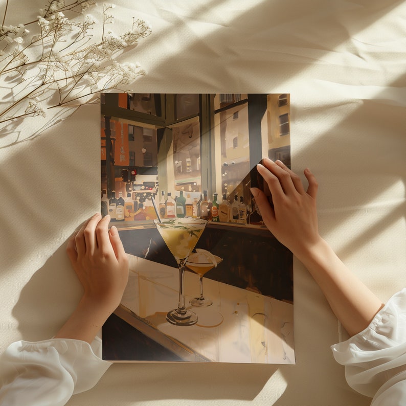 May include: A painting of a bar scene with a window view of a city street. Two martini glasses with olives are on the counter. The glasses are filled with a light yellow liquid. The bar is lined with bottles of liquor.