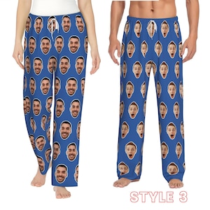 May include: A pair of blue pyjamas with a repeated pattern of a person's face. The pyjamas are shown on two models, one male and one female. The text "STYLE 3" is at the bottom of the image.