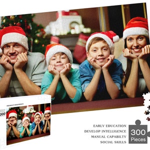 May include: A 300-piece jigsaw puzzle featuring a family of four wearing Santa hats and smiling. The puzzle is set against a festive Christmas backdrop with a decorated tree and fireplace.