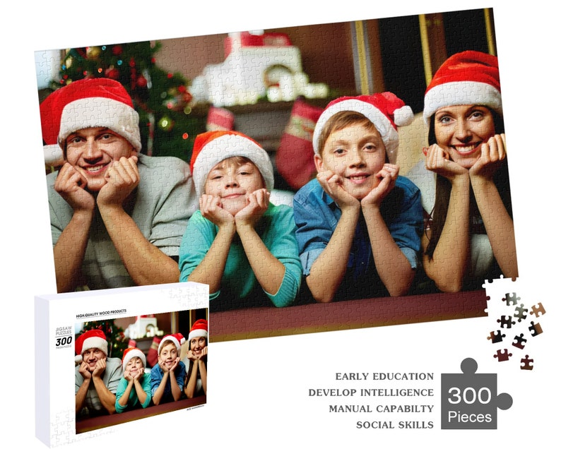 May include: A 300-piece jigsaw puzzle featuring a family of four wearing Santa hats and smiling. The puzzle is set against a festive Christmas backdrop with a decorated tree and fireplace.