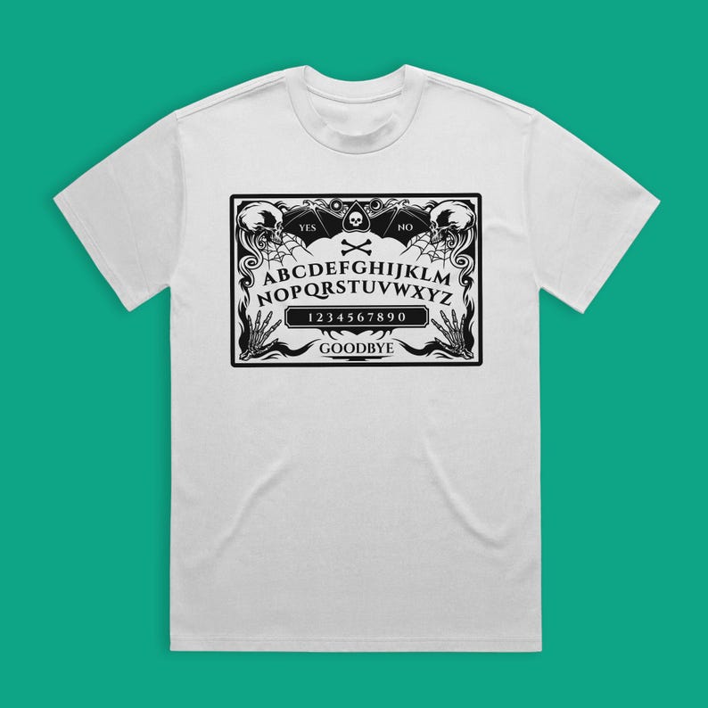 May include: White t-shirt with a black and white graphic of a Ouija board with the text "YES", "NO", "GOODBYE", "ABCDEFGHIJKLMNOPQRSTUVWXYZ", and "1234567890".