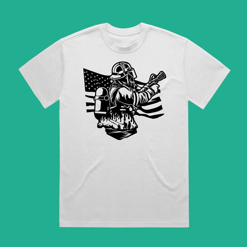 May include: A white t-shirt with a black and white illustration of a firefighter wearing a helmet and holding a hose. The firefighter is standing in front of an American flag.