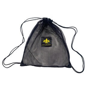 May include: Black mesh drawstring bag with a yellow and black patch featuring a fleur-de-lis and the words "NEW ORLEANS". The bag has a drawstring closure and is designed to carry items.