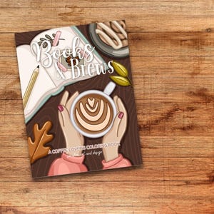 Peut inclure: Une couverture de livre à colorier avec un fond brun représentant une tasse de café avec un art latte, un livre, un pain à la cannelle et des feuilles d'automne. Le titre du livre est "Books & Brews: A Coffee Lovers Coloring Book".