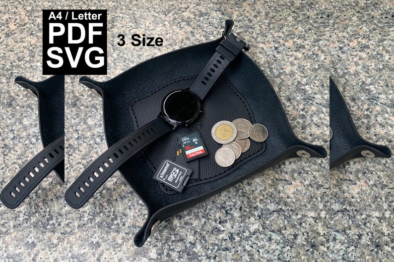 May include: A black leather valet tray with a watch, coins, and SD cards. The tray has a stitched design and curved edges. Text in the image reads "A4 / Letter PDF SVG 3 Size".