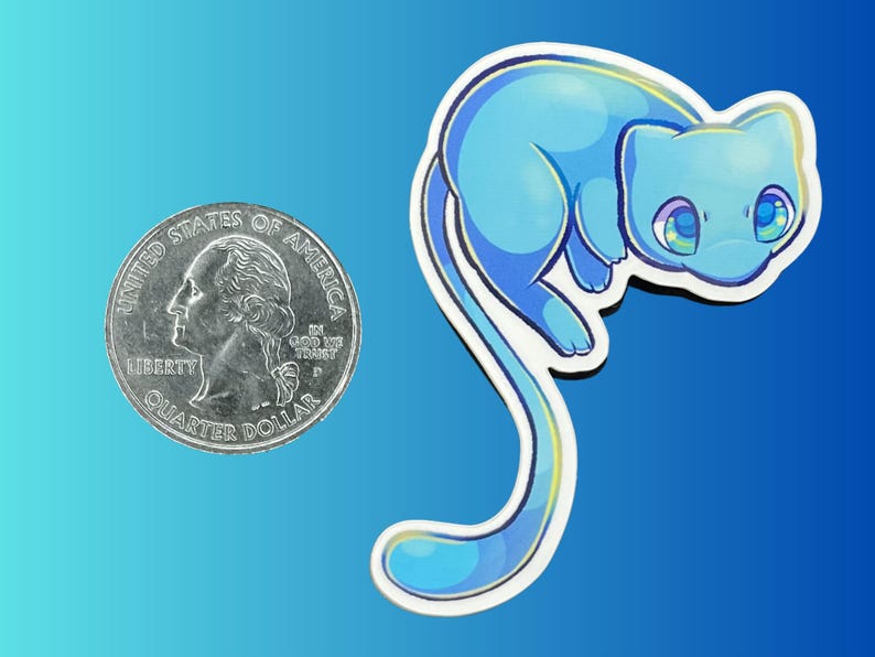 May include: A die-cut sticker featuring a stylized light blue creature with large, expressive eyes and a long, curved tail. The sticker is positioned next to a United States quarter coin for scale, showing the relative size of the illustration.