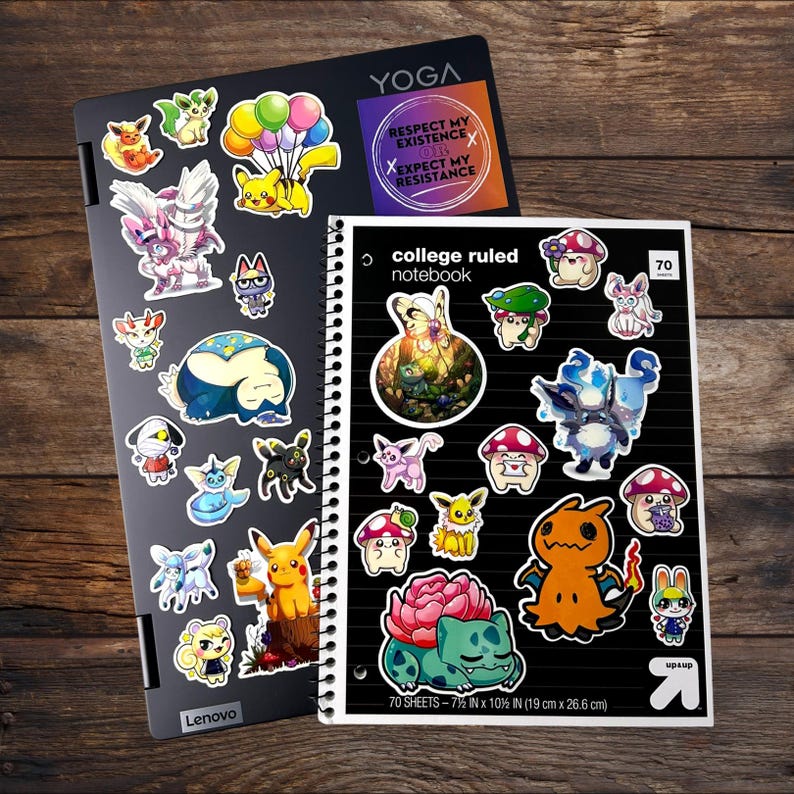May include: A black Lenovo Yoga laptop and a black college ruled notebook, both covered in various colorful cartoon character stickers. The notebook features 70 sheets and measures 7.5 inches by 10.5 inches. A sticker on the laptop reads: RESPECT MY EXISTENCE OR EXPECT MY RESISTANCE.