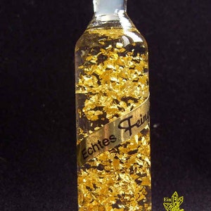 Gold bottle, real gold, decorative bottle, gold flakes in a glass bottle, gold shimmer, investment, wealth corner