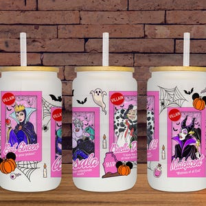 May include: White glass tumbler with a bamboo lid and straw, featuring a pink framed graphic of Disney villains: Evil Queen, Ursula, Cruella De Vil, and Maleficent. Includes Halloween-themed accents like bats, spiderwebs, and pumpkins.