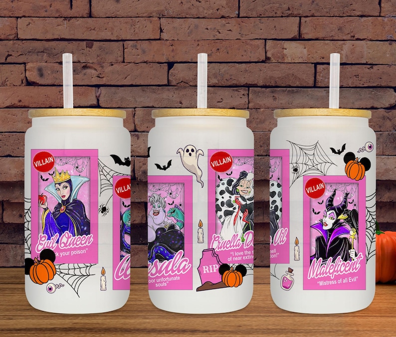 May include: White glass tumbler with a bamboo lid and straw, featuring a pink framed graphic of Disney villains: Evil Queen, Ursula, Cruella De Vil, and Maleficent. Includes Halloween-themed accents like bats, spiderwebs, and pumpkins.
