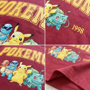 May include: Maroon t-shirt featuring a yellow "POKEMON" graphic. The shirt showcases cartoon characters Pikachu, Bulbasaur, Squirtle, and Charmander. The year "1998" is printed on the shirt. The shirt is made of a soft material.