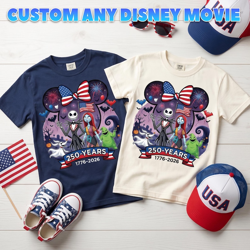 May include: Two short-sleeved t-shirts, one navy blue and one cream, featuring a graphic of Jack Skellington, Sally, and Oogie Boogie with a Mickey Mouse-shaped silhouette, fireworks, and the text 250-YEARS 1776-2026, alongside two USA baseball caps and trainers.