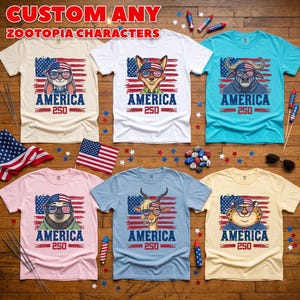 May include: Collection of Zootopia character t-shirts with an American flag design. Each shirt features a different character wearing sunglasses, the word "AMERICA", and the number "250". The shirts are in various colors.