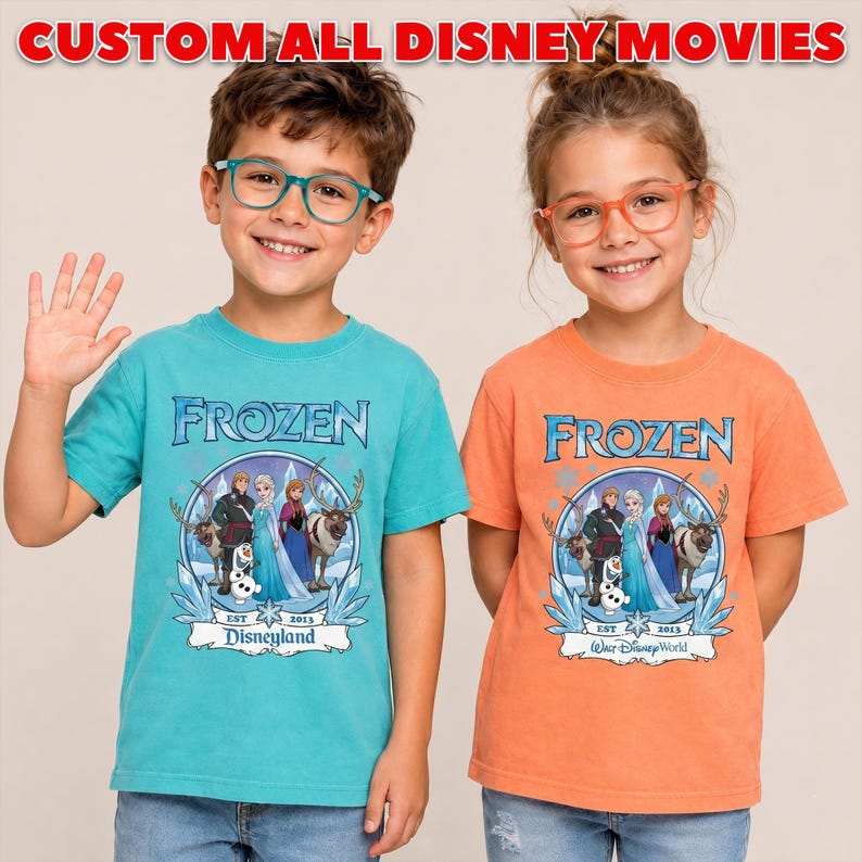 May include: Two children wearing teal and orange t-shirts with the word "FROZEN" in blue. The shirts feature a graphic of characters from the Disney movie Frozen, with the text "Disneyland" and "Walt Disney World". The text "CUSTOM ALL DISNEY MOVIES" is at the top.