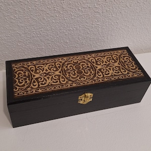 Medieval wooden box engraved with interlacing Middle Ages style brooches tea jewelry stones crystals artifacts medal